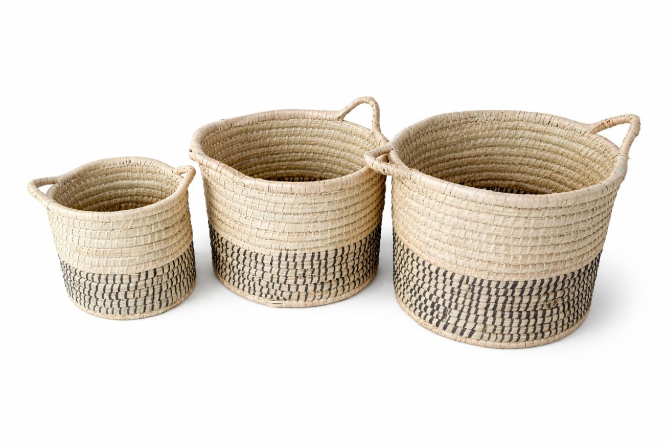 Set of three cylindrical woven baskets