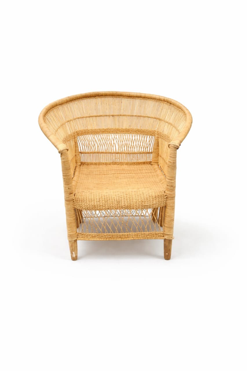 Light brown wicker chair with curved backrest