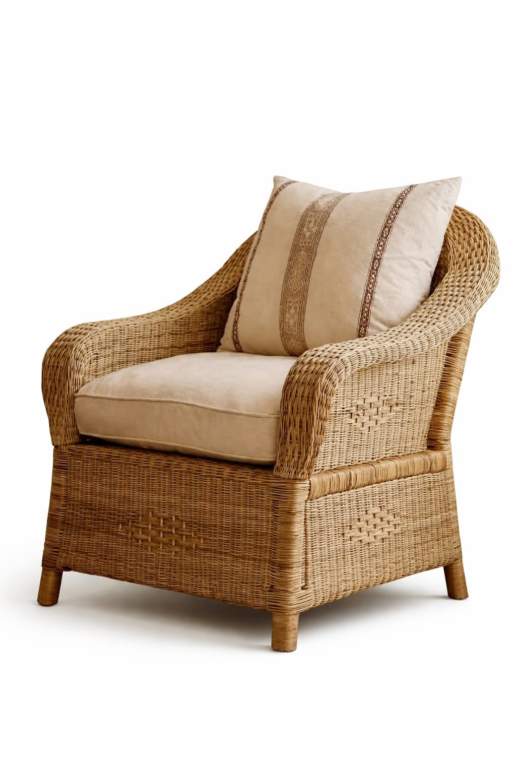 Wicker armchair with beige cushions